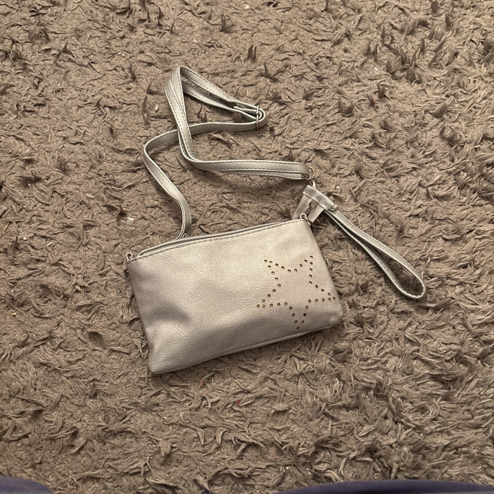 Silver star crossbody bag with adjustable strap with charger inside
